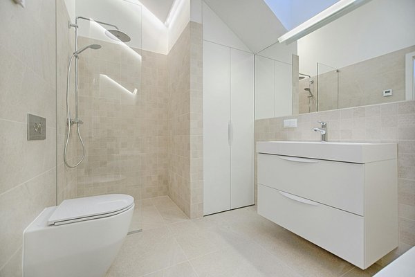 How can you design a small UK bathroom that feels luxurious and spa-like?